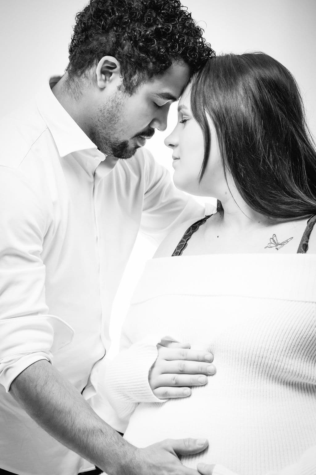 Intimate maternity moment in black and white