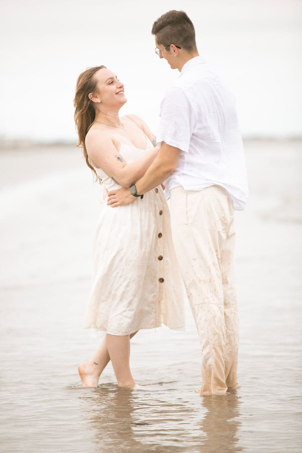 Couple in shallow water at the beach
