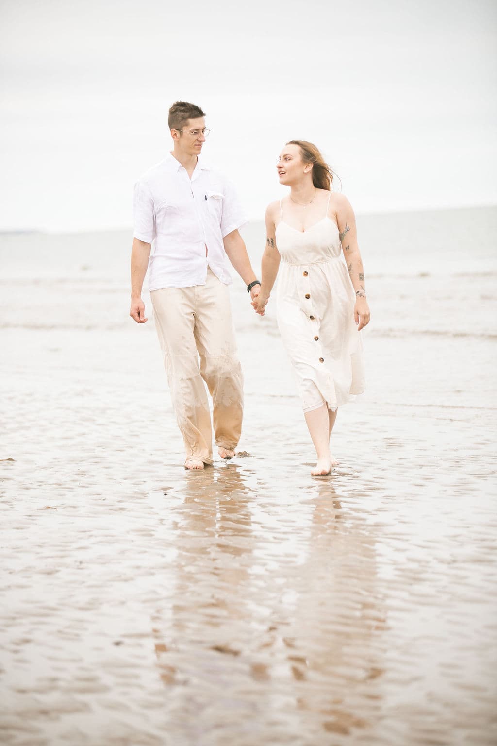 Couple walking along the shoreline
